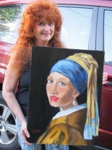 Me holding the portrait I did of the 'Girl With the Pearl Earring"